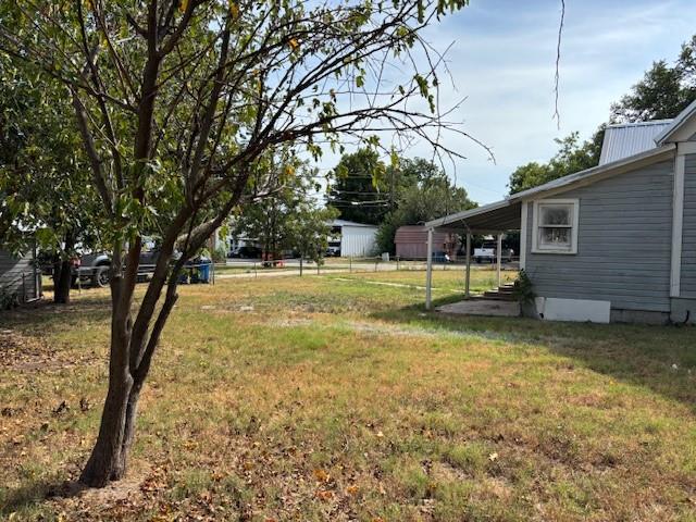 811 West 8th Street Cisco, TX 76437 - Photo 6 of 22 a view of patio with a yard