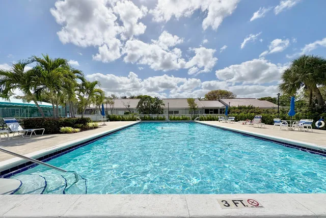 an aerial view of a house with yard