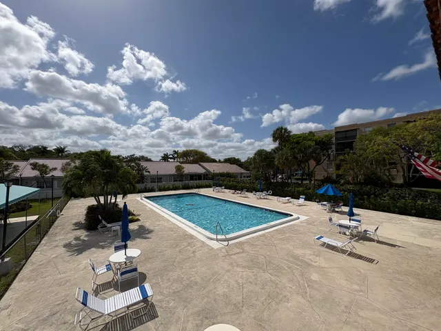 a view of a swimming pool with a patio