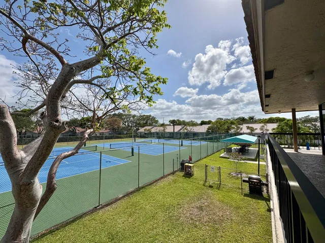 a couple of cars parked in front of a house