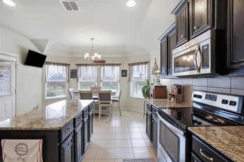 a kitchen with granite countertop lots of counter top space