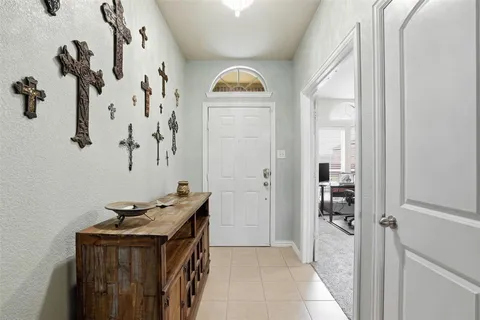 a bathroom with a granite countertop sink a mirror and shower