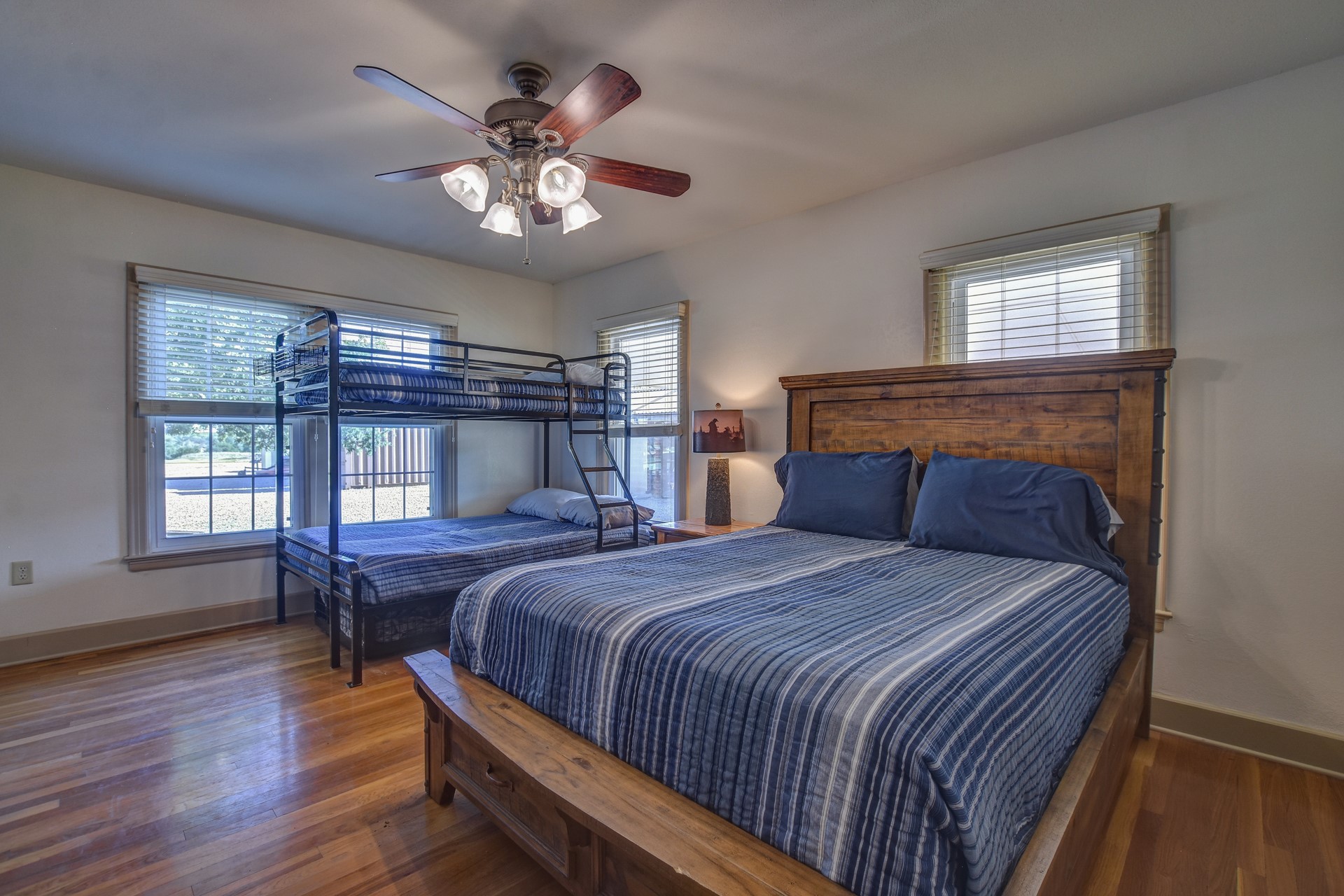 18601 County Road 214 Brookesmith, TX 76827 - Photo 33 of 39 Hunter's Cabin: Bedroom with dark wood-style floors and ceiling fan