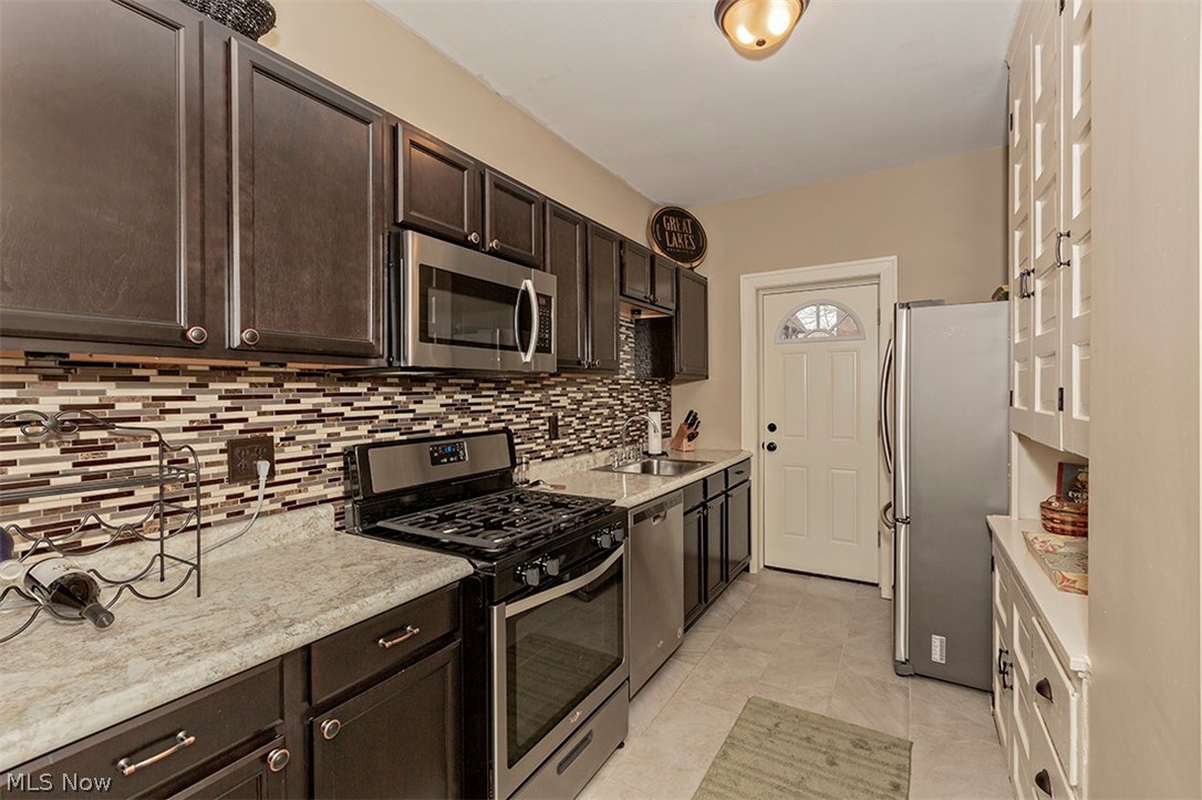 2116 Surrey Road, Unit 2 Cleveland, OH 44106 - Photo 8 of 27 Functional, clean up updated kitchen with access to back door and porch.
