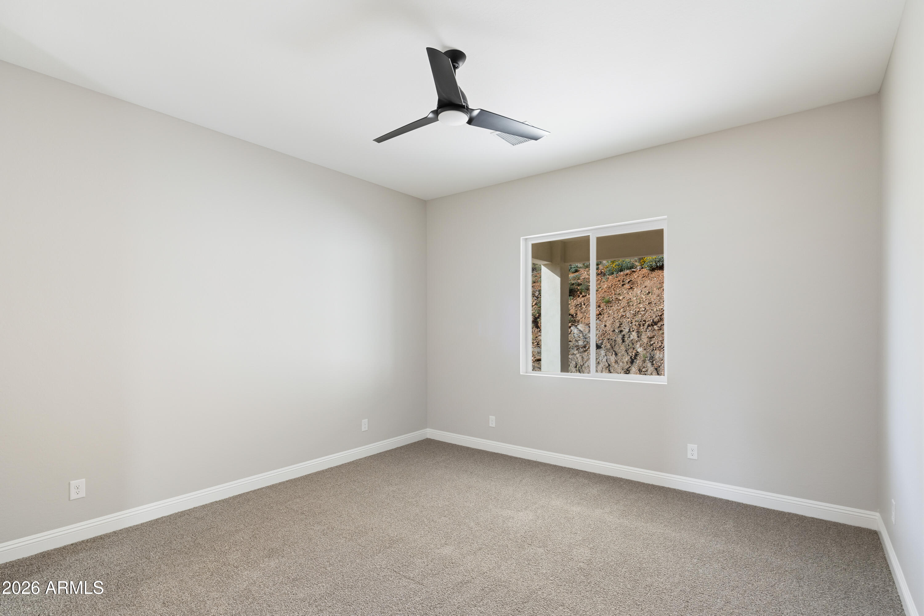 1687 East Creek Canyon Road Phoenix, AZ 85086 - Photo 17 of 31 an empty room with a window