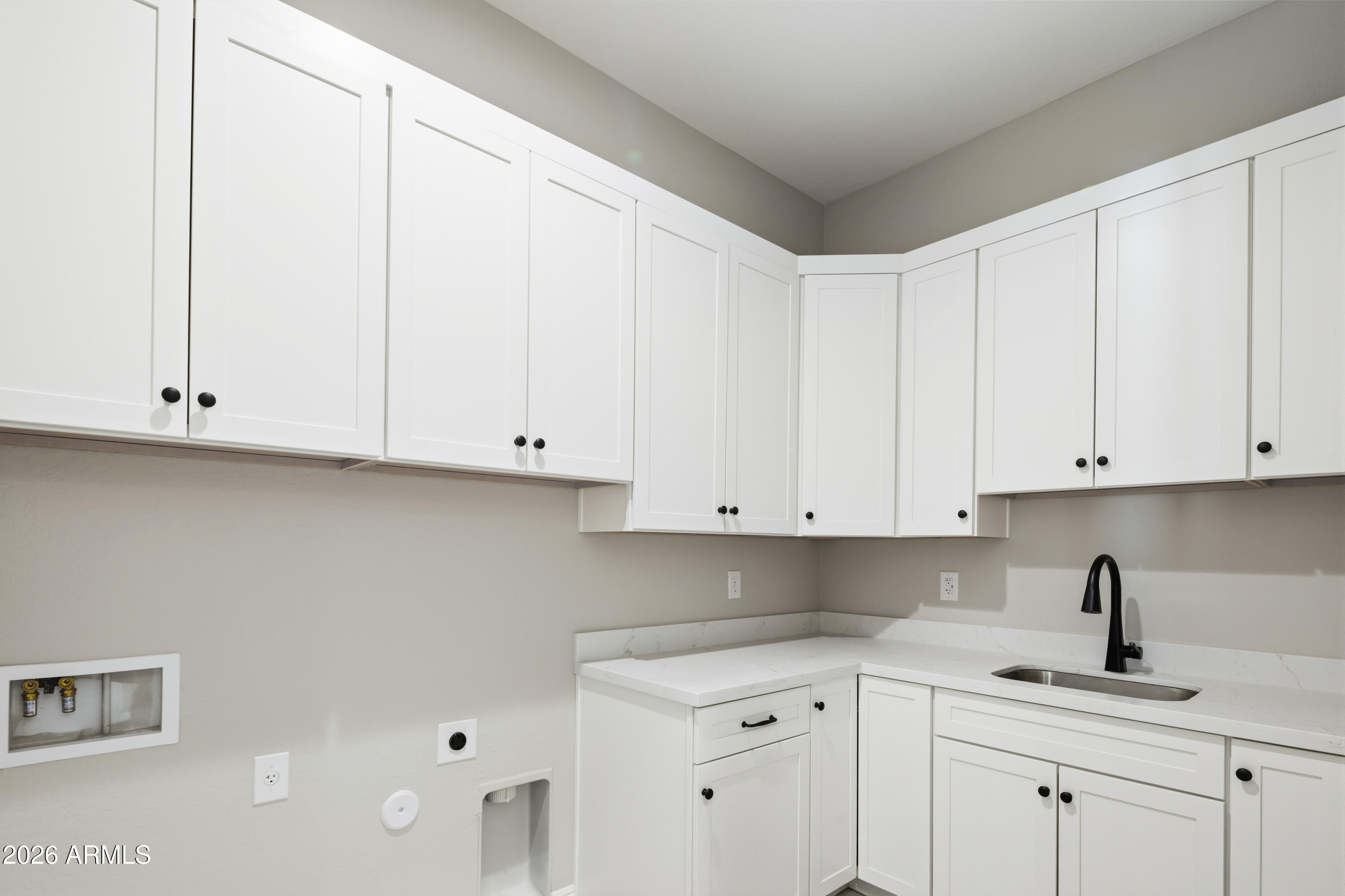 1687 East Creek Canyon Road Phoenix, AZ 85086 - Photo 27 of 31 a kitchen with stainless steel appliances granite countertop white cabinets and a sink
