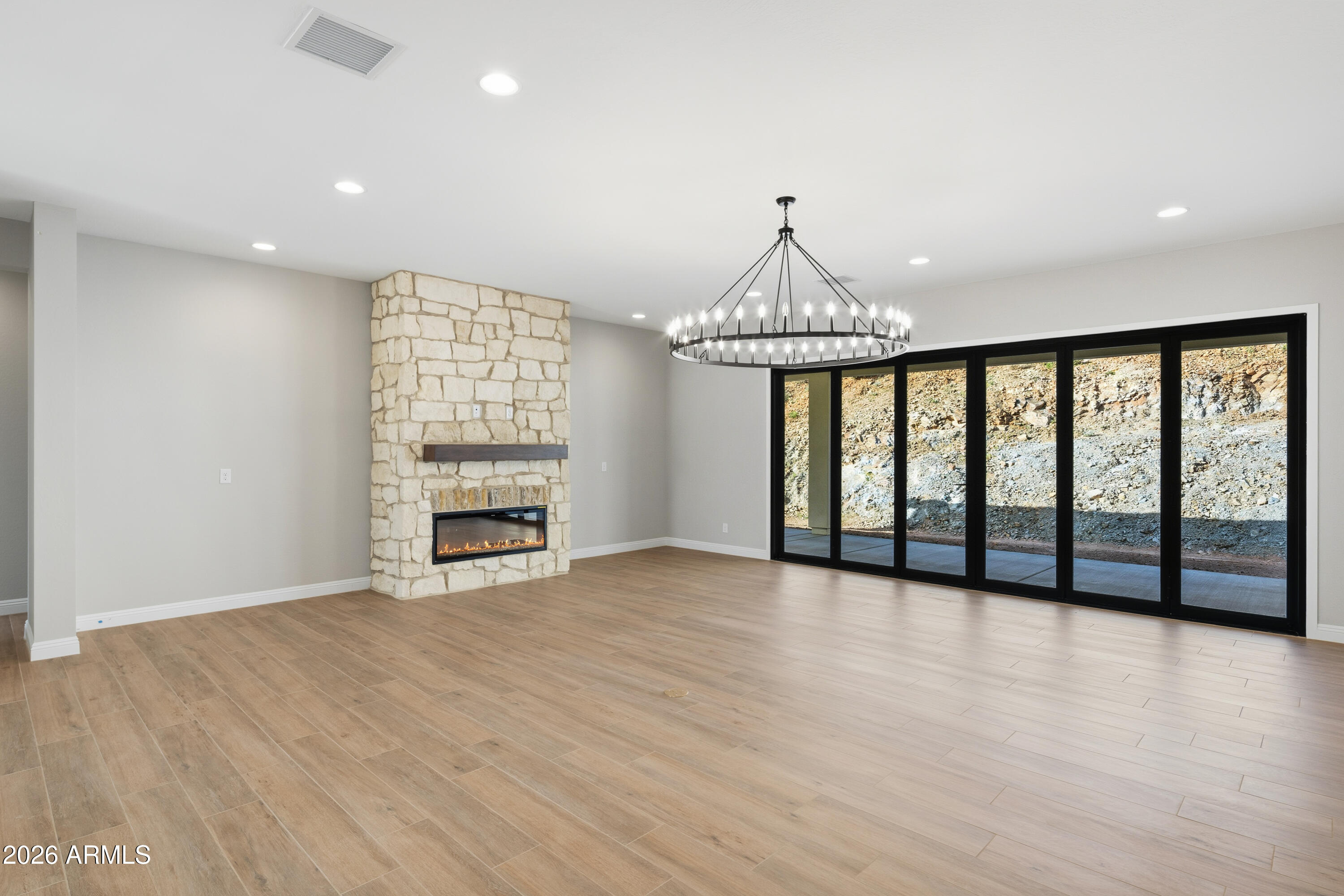 1687 East Creek Canyon Road Phoenix, AZ 85086 - Photo 5 of 31 a view of an empty room with a window and fireplace