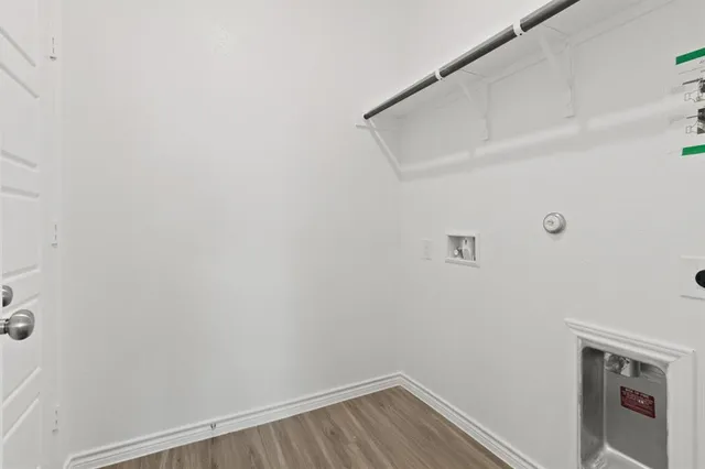 a view of small space with empty racks on the wall