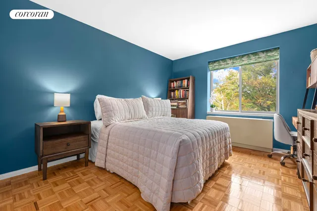 a bathroom with a sink a toilet a mirror a bathtub and shower