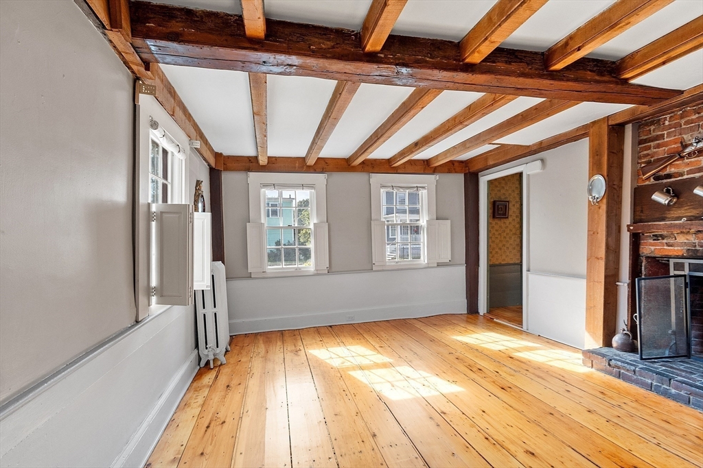 156 Hale Street Beverly, MA 01915 - Photo 11 of 42 a view of empty room with wooden floor and fan