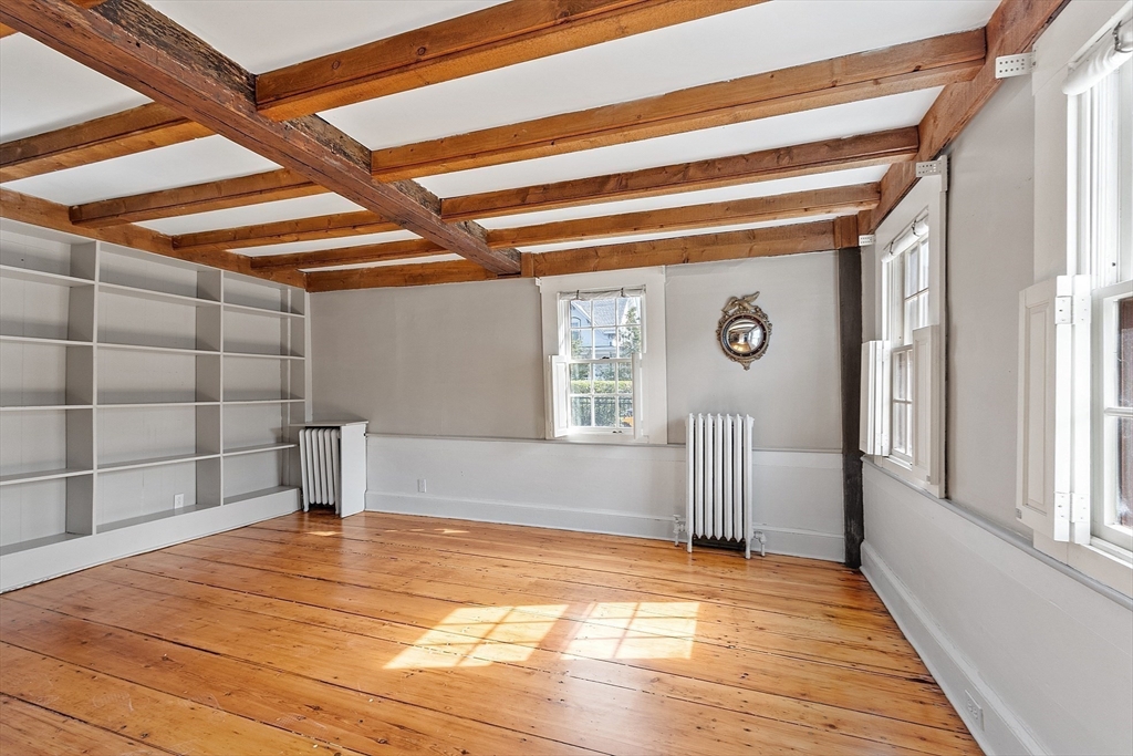 156 Hale Street Beverly, MA 01915 - Photo 12 of 42 a view of empty room with wooden floor and fan