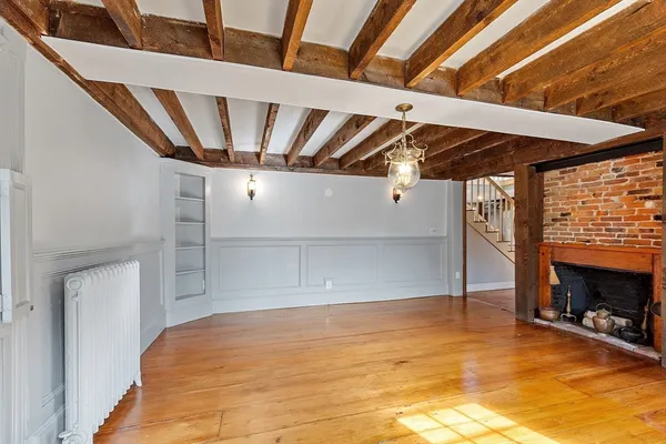 a view of a livingroom with wooden floor