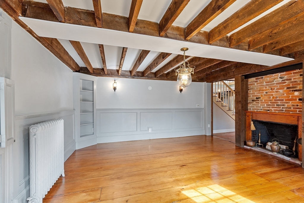 156 Hale Street Beverly, MA 01915 - Photo 13 of 42 a view of an empty room with wooden floor
