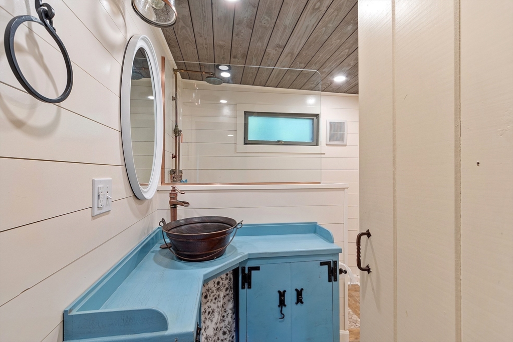 156 Hale Street Beverly, MA 01915 - Photo 17 of 42 a bathroom with a sink and a mirror