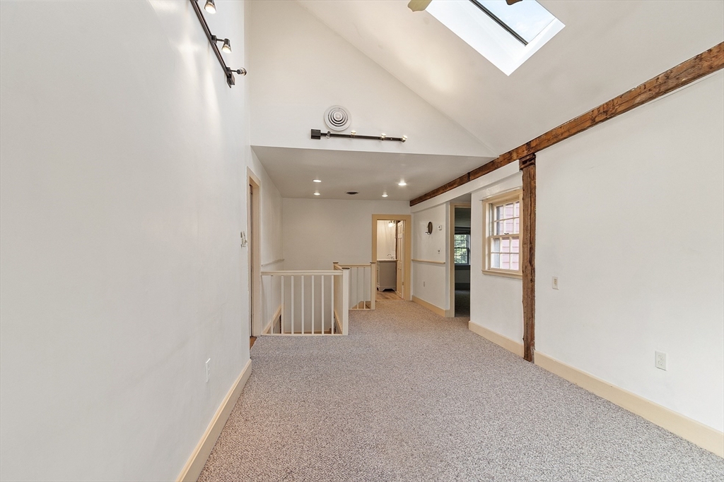 156 Hale Street Beverly, MA 01915 - Photo 21 of 42 a view of a hallway with stairs