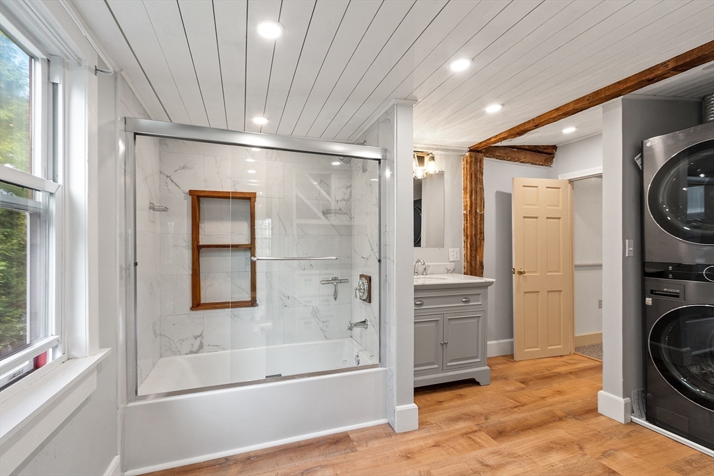 156 Hale Street Beverly, MA 01915 - Photo 25 of 42 a bathroom with a bathtub and a shower