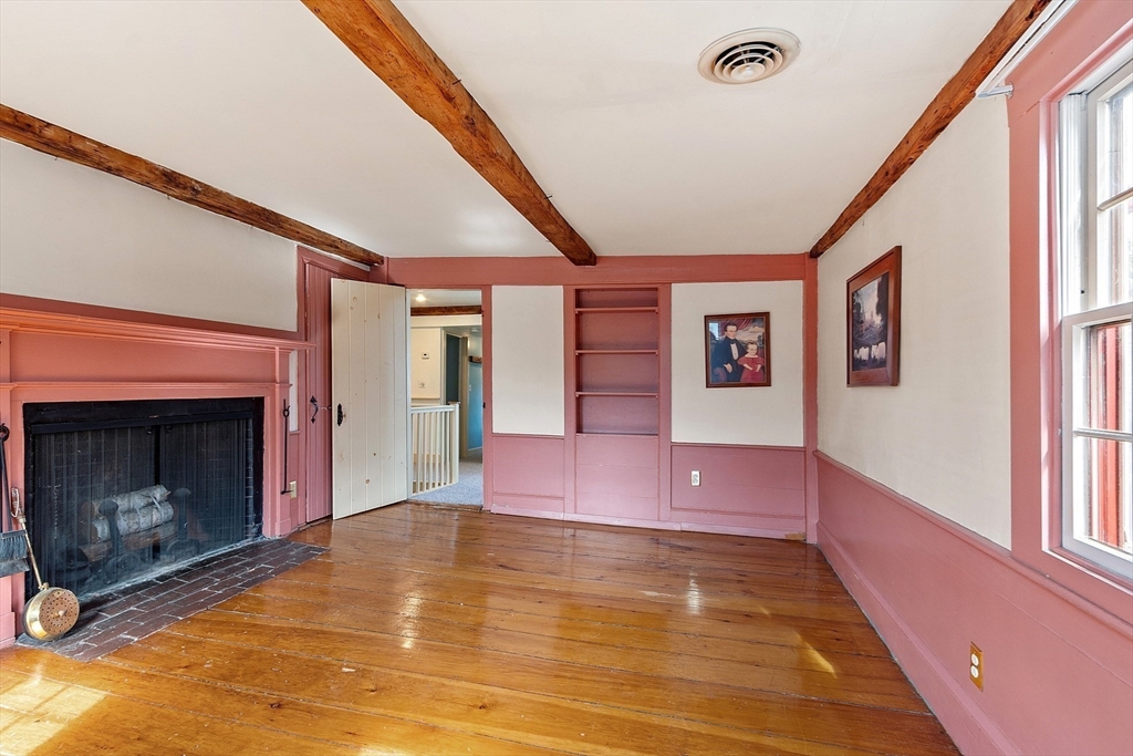 156 Hale Street Beverly, MA 01915 - Photo 29 of 42 a view of an entryway with a fireplace and window