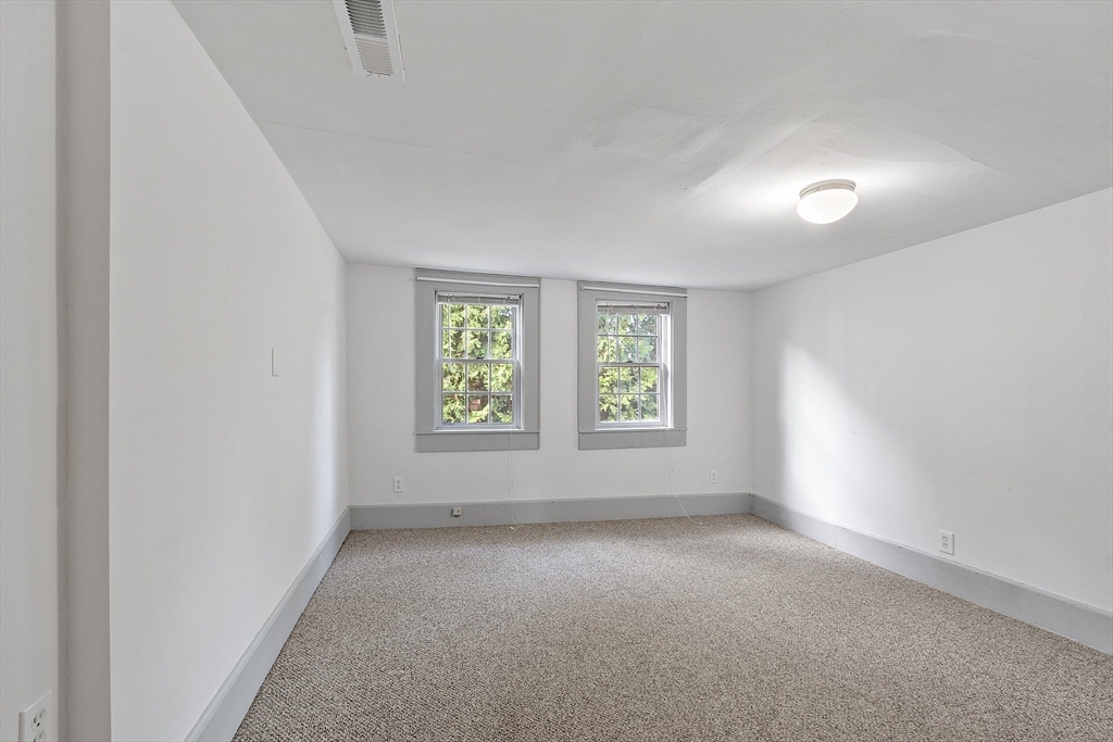 156 Hale Street Beverly, MA 01915 - Photo 30 of 42 an empty room with windows