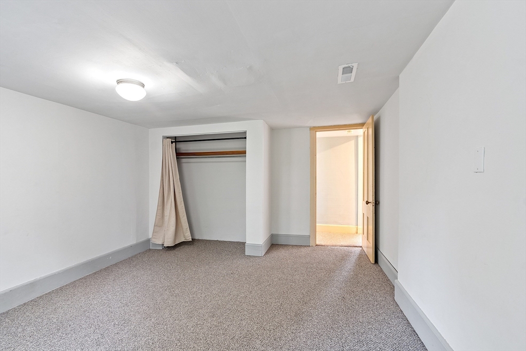 156 Hale Street Beverly, MA 01915 - Photo 31 of 42 a view of an empty room and a window