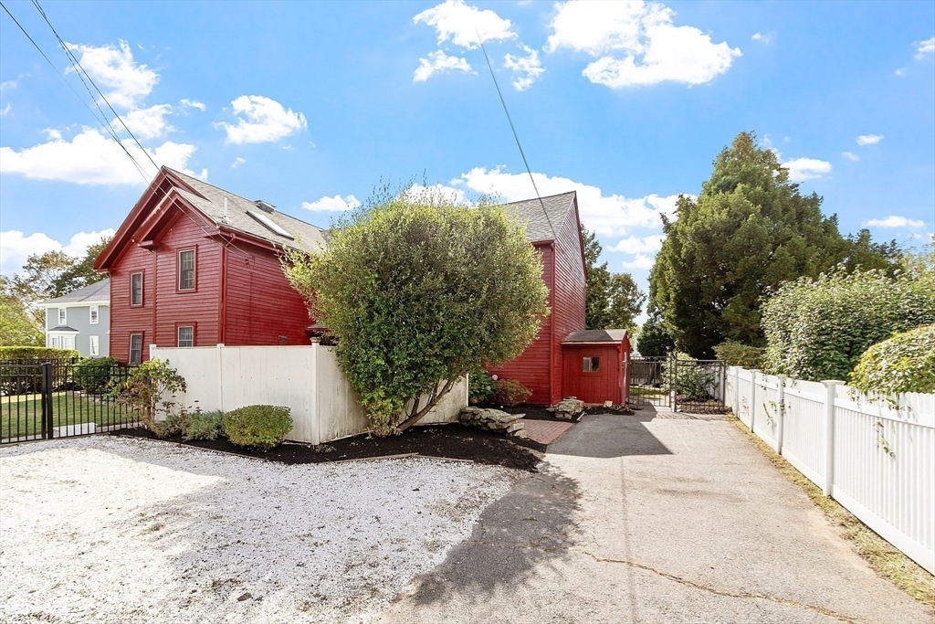 156 Hale Street Beverly, MA 01915 - Photo 32 of 42 a view of a house with a yard and potted plants
