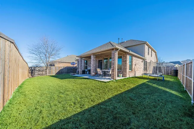 a view of a house with backyard porch and garden