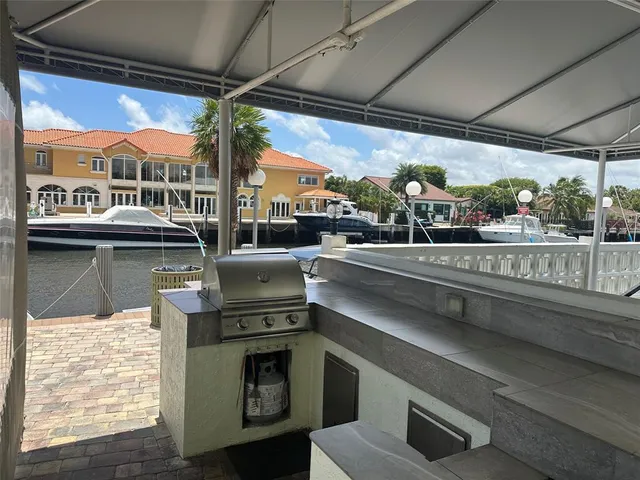 a outdoor kitchen with a stove and a table