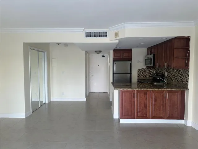 a view of hallway with cabinets