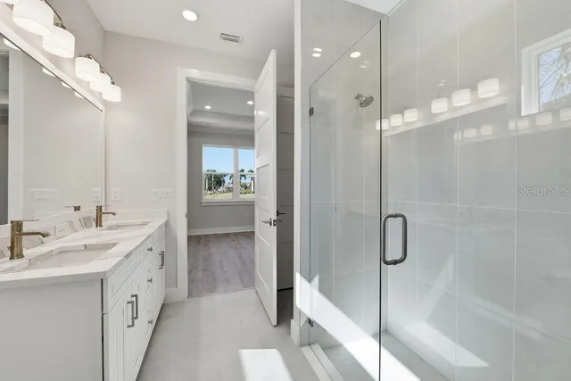 a view of a patio with table and chairs potted plants with lake view