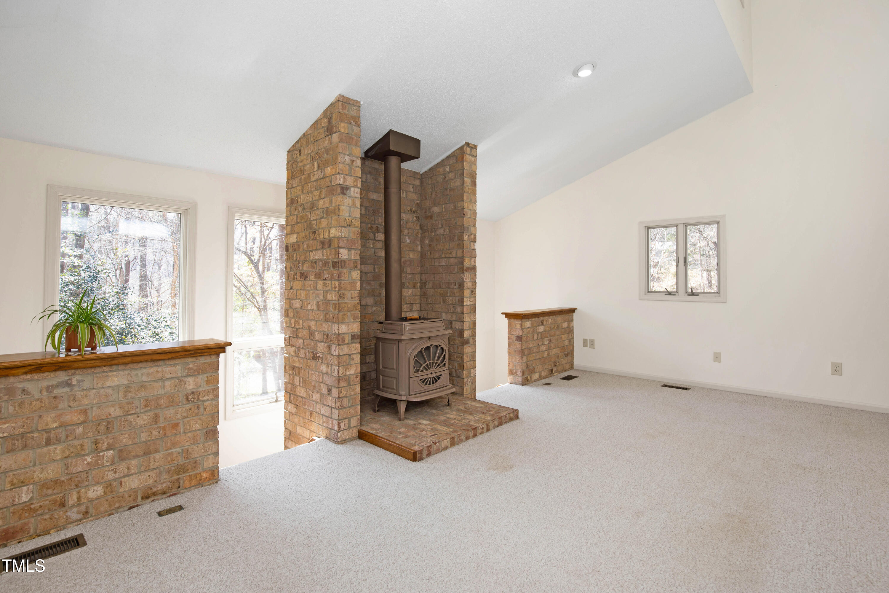 7409 Birch Tree Lane Wake Forest, NC 27587 - Photo 22 of 72 an empty room with windows
