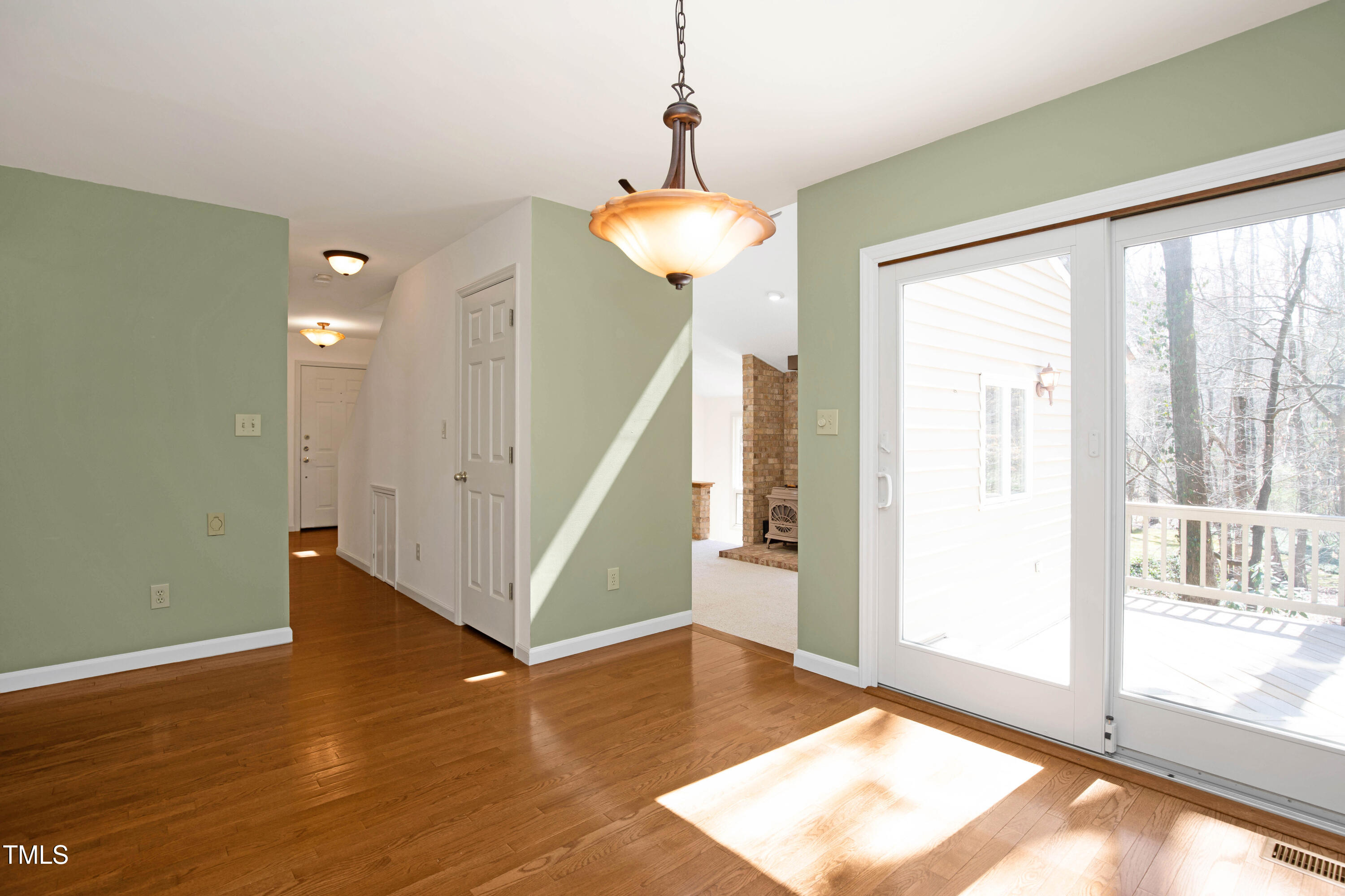 7409 Birch Tree Lane Wake Forest, NC 27587 - Photo 29 of 72 a view of a room with wooden floor and door