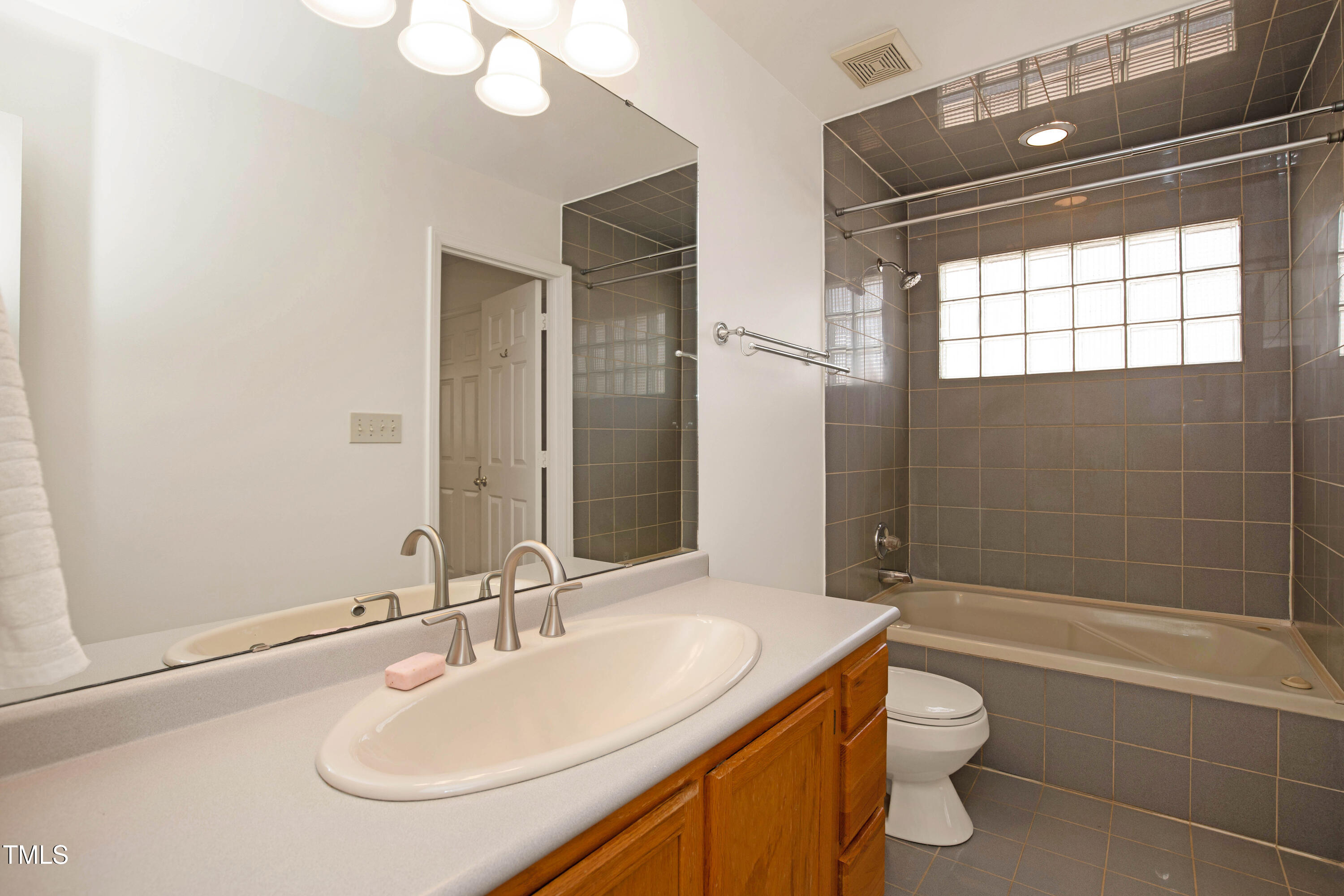 7409 Birch Tree Lane Wake Forest, NC 27587 - Photo 36 of 72 a bathroom with a sink a toilet and shower