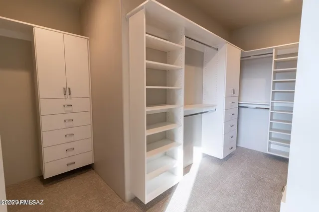 a view of an empty walk in closet
