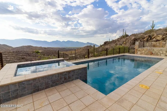 a view of a swimming pool with a terrace