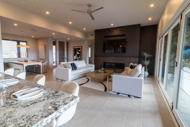 a living room with fireplace furniture and a flat screen tv