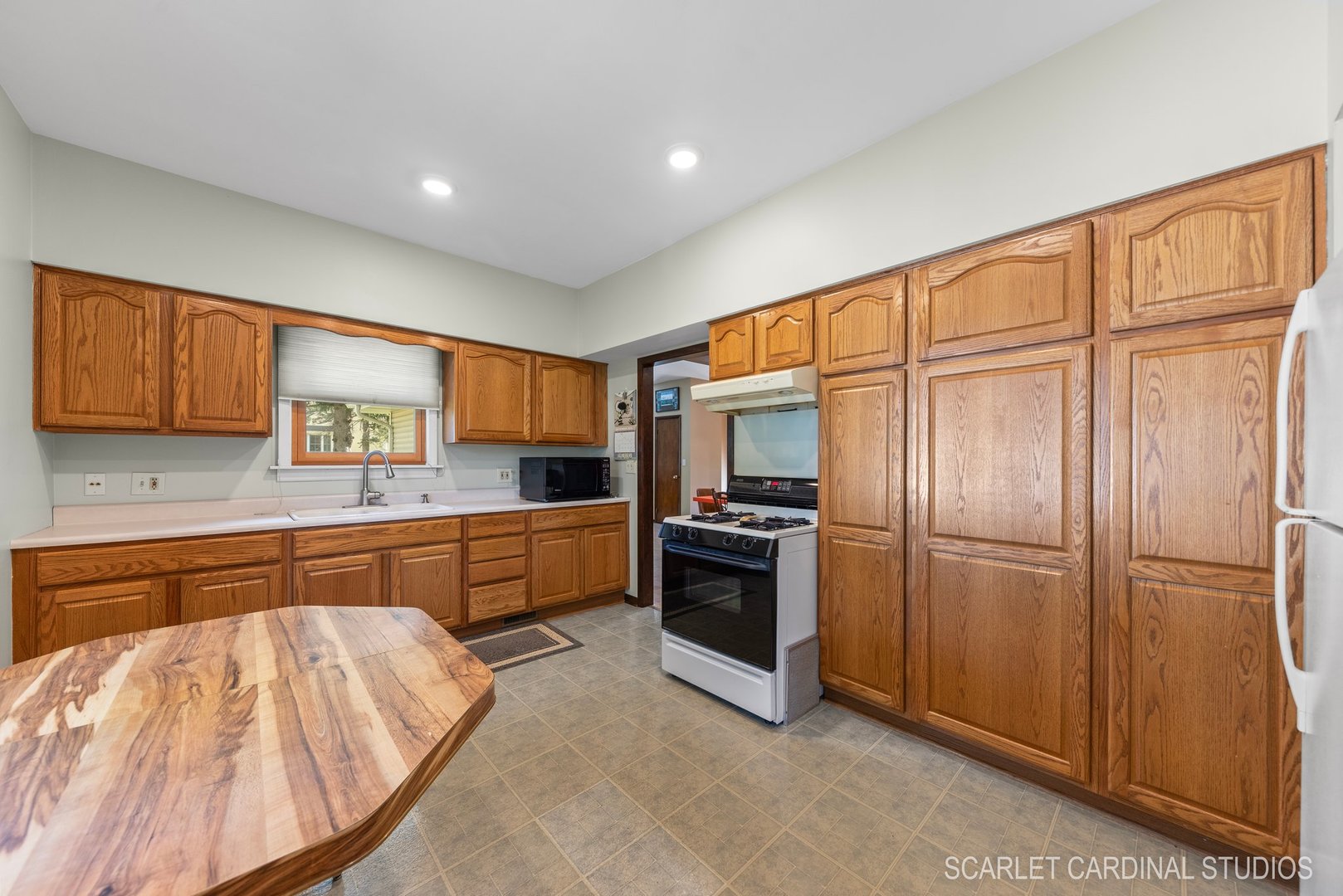 204 West Harding Road Lombard, IL 60148 - Photo 7 of 18 a kitchen with stainless steel appliances granite countertop a refrigerator and wooden cabinets