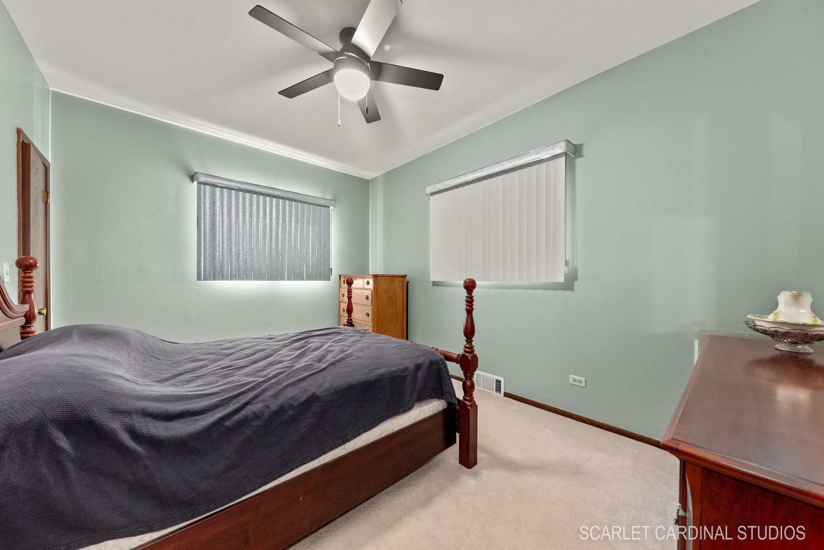 204 West Harding Road Lombard, IL 60148 - Photo 10 of 18 a bedroom with a bed and a chandelier