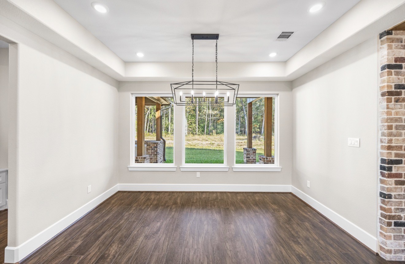 41 A Pausel Road Huntsville, TX 77340 - Photo 18 of 34 wooden floor in an empty room with a window