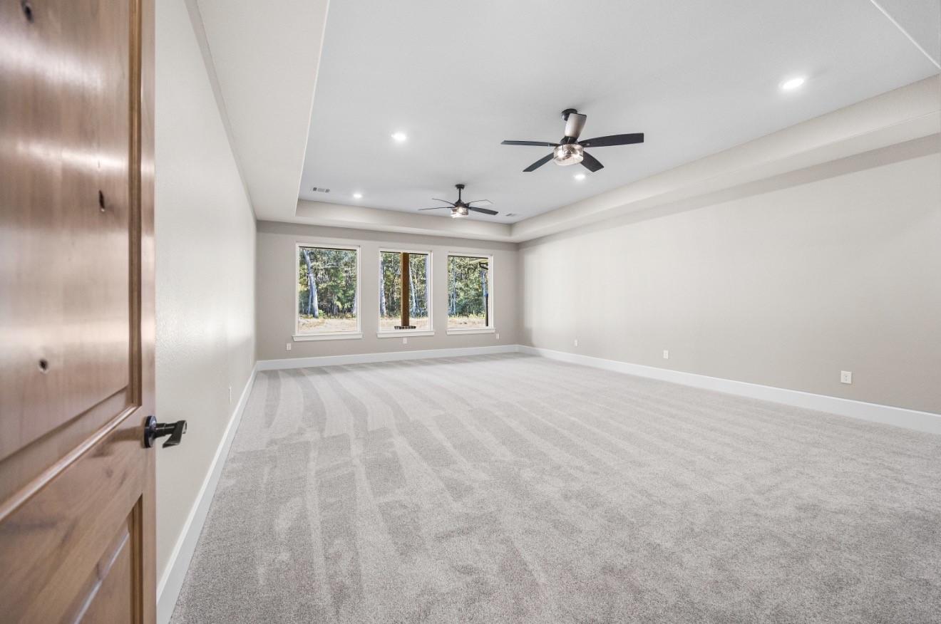 41 A Pausel Road Huntsville, TX 77340 - Photo 27 of 34 an empty room with windows and fireplace