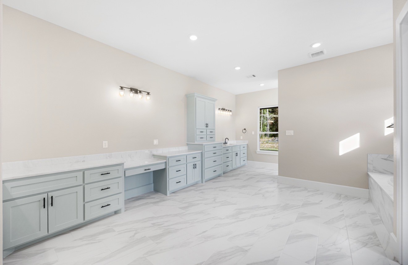41 A Pausel Road Huntsville, TX 77340 - Photo 30 of 34 a bathroom with a granite countertop sink mirror and a toilet