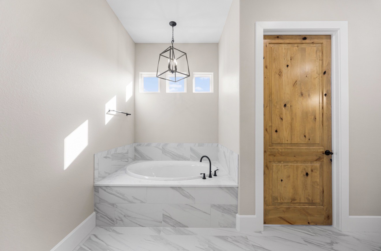 41 A Pausel Road Huntsville, TX 77340 - Photo 32 of 34 a bathroom with a tub and shower