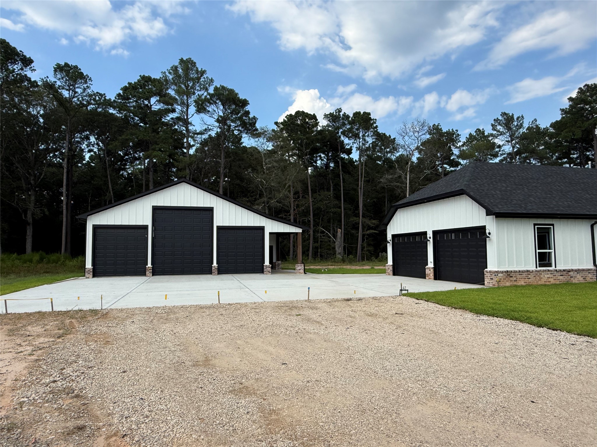 41 A Pausel Road Huntsville, TX 77340 - Photo 4 of 34 a front view of a house with a yard and garage