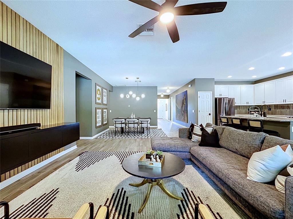 18078 Romanesque Court Spring Hill, FL 34610 - Photo 23 of 81 a living room with furniture and a flat screen tv