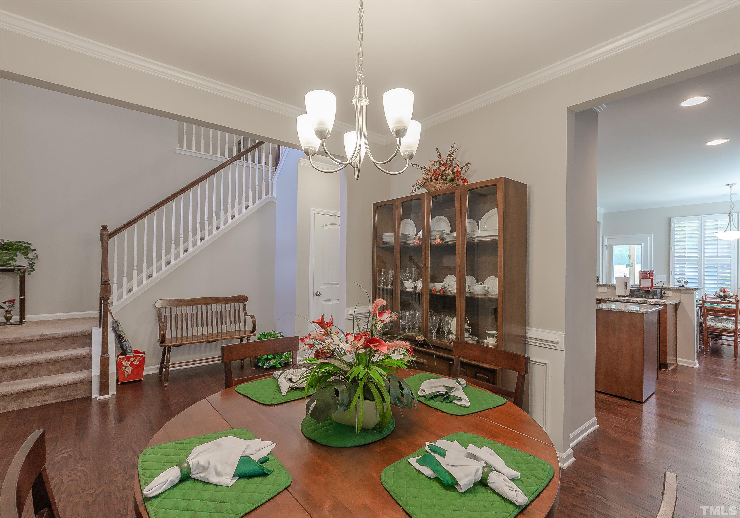 1104 Big Spring Circle Durham, NC 27703 - Photo 15 of 47 a living room filled with furniture and a chandelier