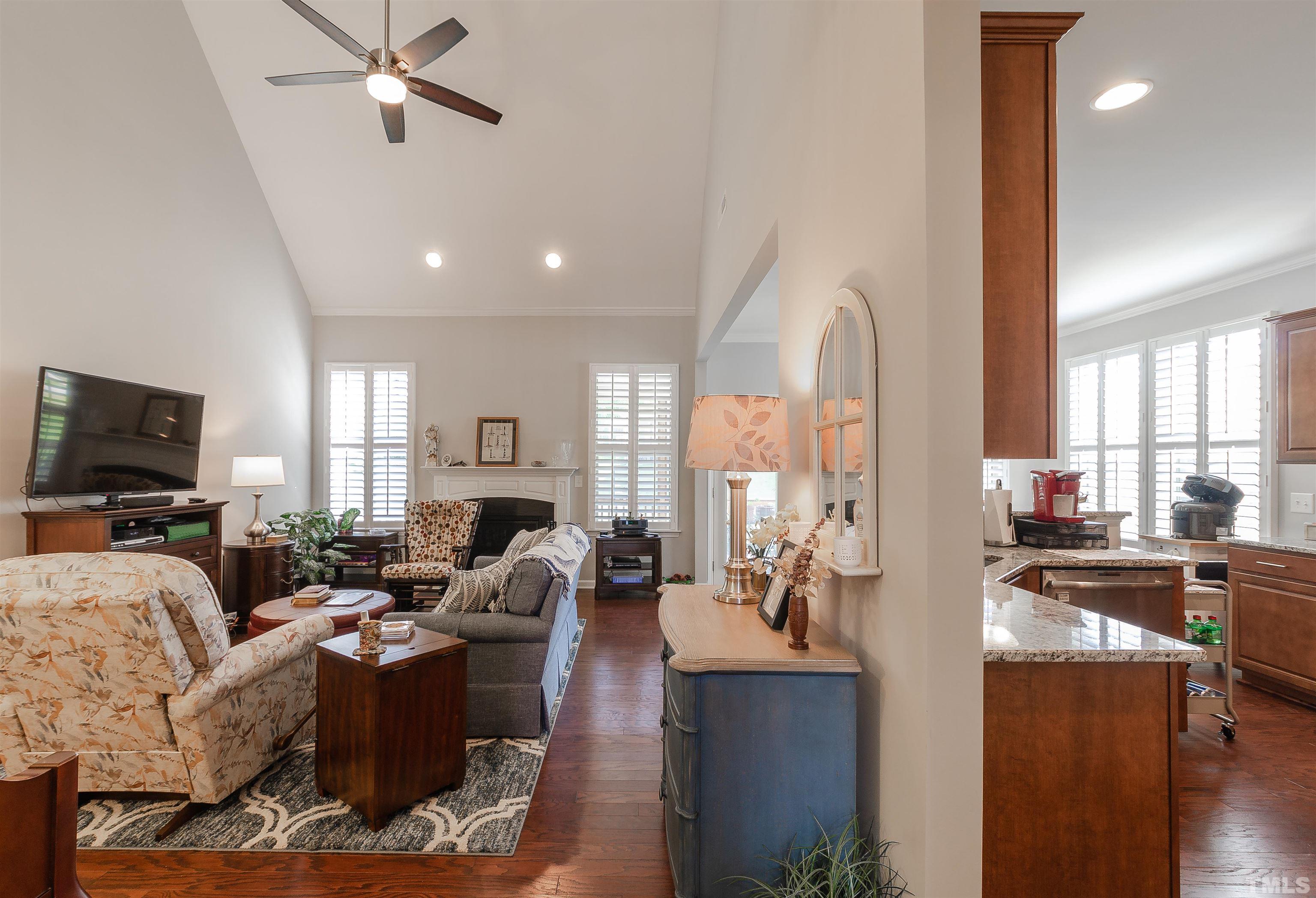 1104 Big Spring Circle Durham, NC 27703 - Photo 17 of 47 a living room with fireplace furniture and a flat screen tv