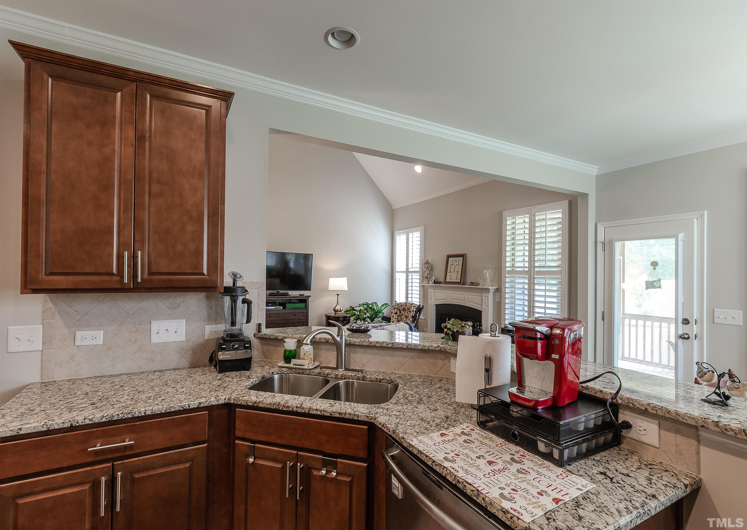 1104 Big Spring Circle Durham, NC 27703 - Photo 19 of 47 a kitchen with a sink cabinets and window