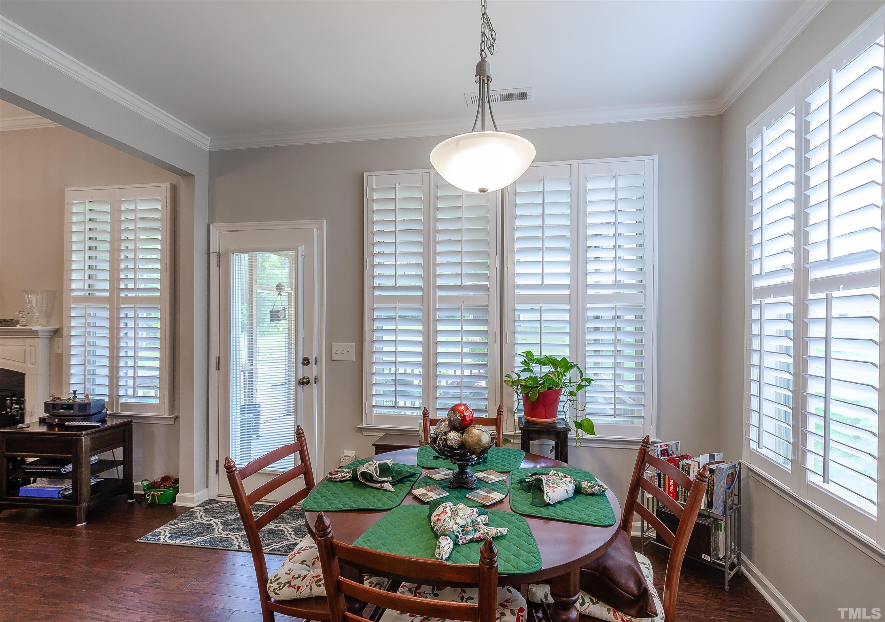 1104 Big Spring Circle Durham, NC 27703 - Photo 22 of 47 a view of a dining room with furniture window and wooden floor