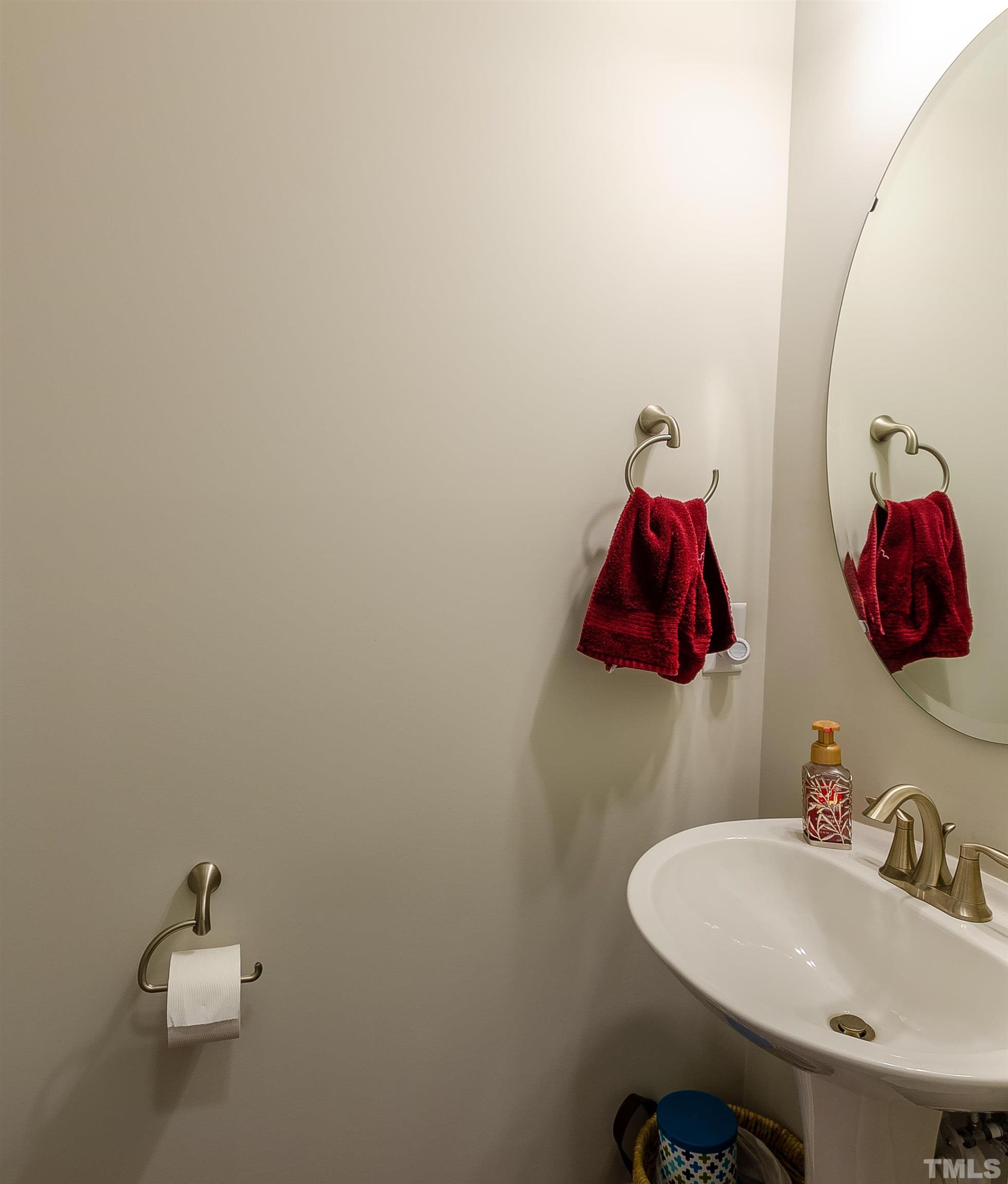 1104 Big Spring Circle Durham, NC 27703 - Photo 29 of 47 a bathroom with a sink and a mirror