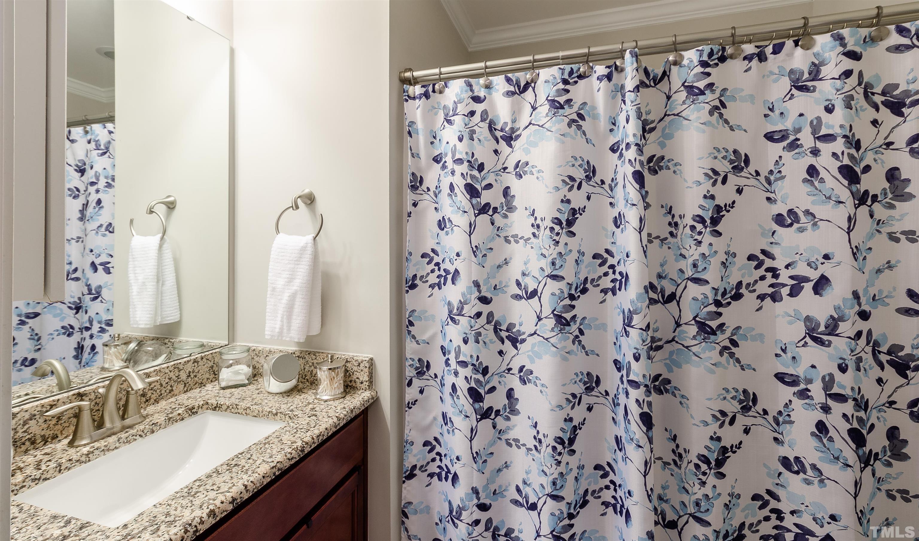1104 Big Spring Circle Durham, NC 27703 - Photo 34 of 47 a bathroom with a granite countertop sink and a mirror