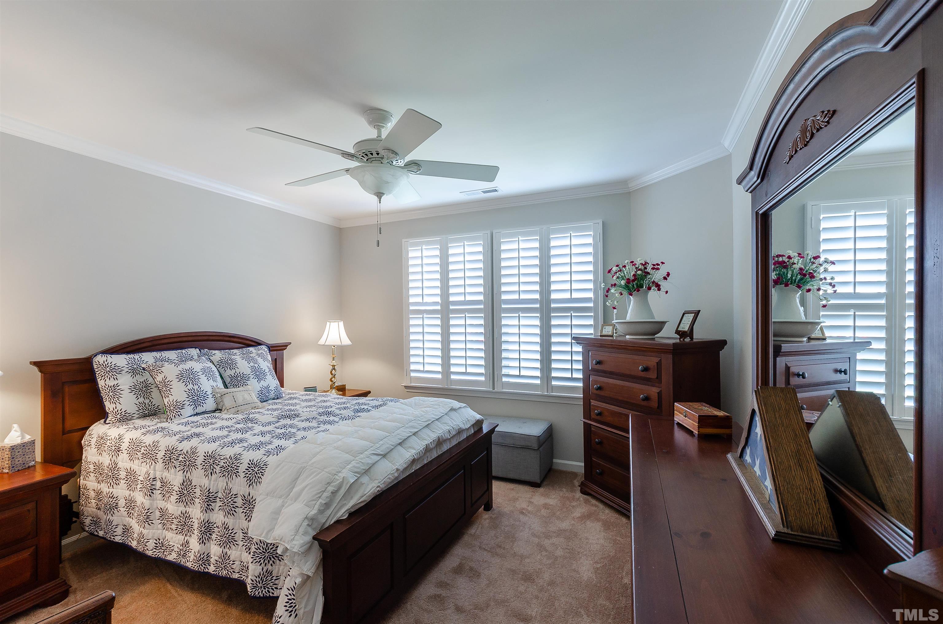 1104 Big Spring Circle Durham, NC 27703 - Photo 36 of 47 a bedroom with a bed and a desk