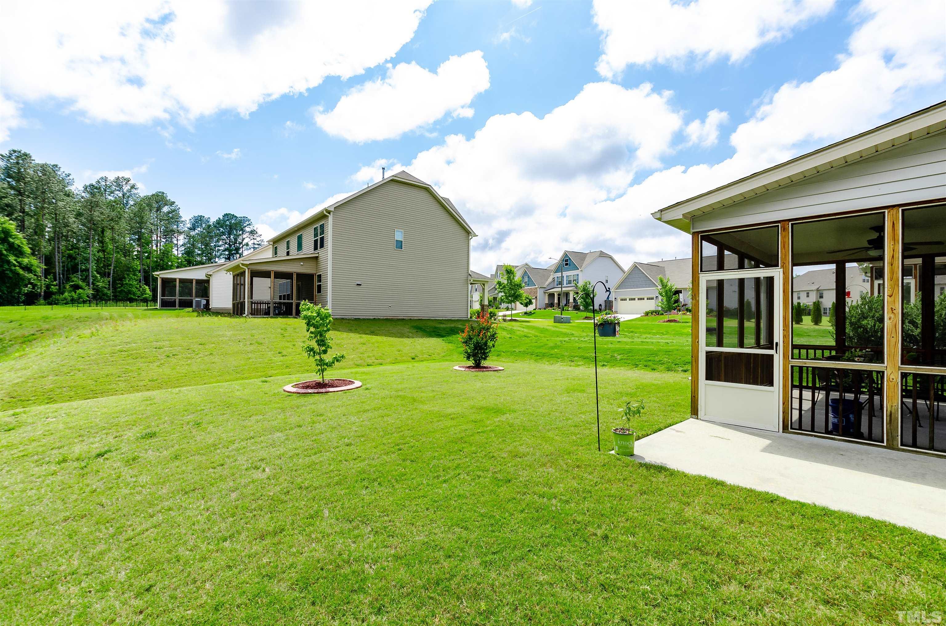 1104 Big Spring Circle Durham, NC 27703 - Photo 47 of 47 a view of a house with a yard and sitting area